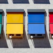 Vibrant awnings in primary colors on a building facade, Donauwörth, Germany.