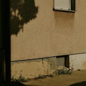 Captivating urban shadow play on a historic building wall in Kassel, Germany.