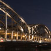 Stunning view of a steel bridge illuminated at night in Hamburg, Germany.