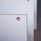 Macro shot of wooden board with dowel pin for furniture assembly.