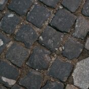 Detailed view of cobblestone pavement showing texture and arrangement.
