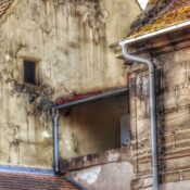Rustic building facade showing aging textures and classic architecture details.