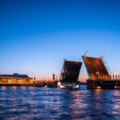 A stunning view of the Palace Bridge illuminated at twilight in St. Petersburg, Russia.