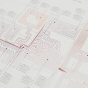 Close-up view of a detailed architectural blueprint with intricate designs and data points.