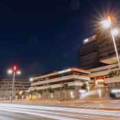 Stunning night view of illuminated GENO-Haus building in Stuttgart, Germany with light trails.