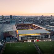 A stunning aerial shot of FC St. Pauli Stadium in Hamburg during a beautiful sunset.