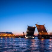 A stunning view of the Palace Bridge illuminated at twilight in St. Petersburg, Russia.