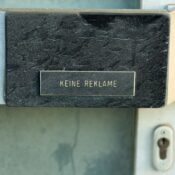 Sign reading 'Keine Reklame' on a door in Austria, no advertising.